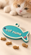 Teal personalized fish-shaped cat name tag with a cat and fish-shaped treats