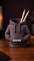 Personalized 3D-printed hoodie pencil holder with custom white name, front view