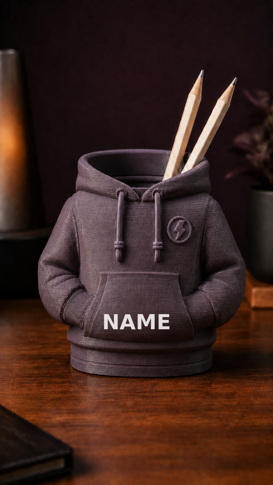 Personalized 3D-printed hoodie pencil holder with custom white name, front view